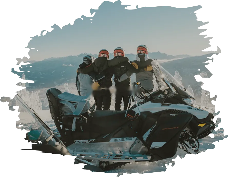 Riders with a Ski-Doo snowmobile on a mountain top, a BRP Experiences adventure