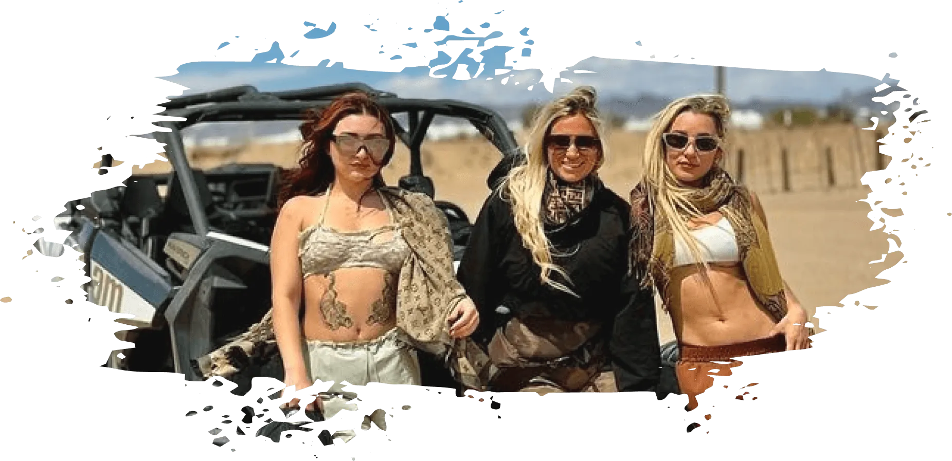 Group standing beside a Can-Am UTV rental during a Glamis Sand Dunes trip